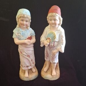 Vintage Ceramic Figurines in Traditional Attire
